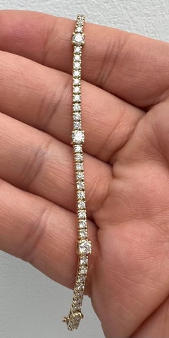 14k Yellow Gold Tennis Bracelet with 5 Bigger Diamonds and a Unique Look