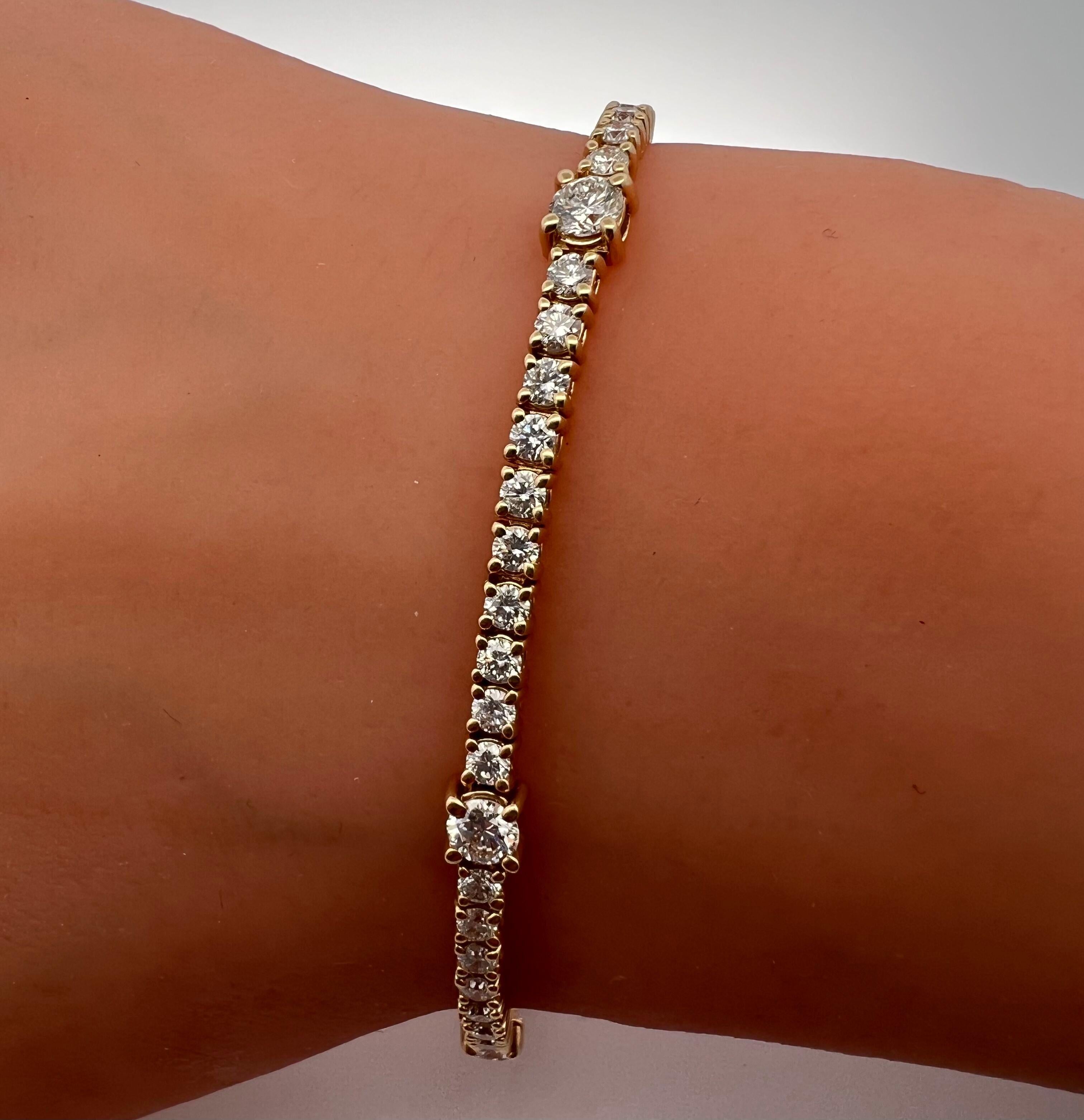 Round Cut 14k Yellow Gold Tennis Bracelet with 5 Bigger Diamonds and a Unique Look For Sale