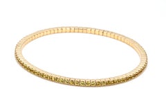 Pulsera elástica de tenis de oro amarillo de 14 quilates engastada con zafiro amarillo natural