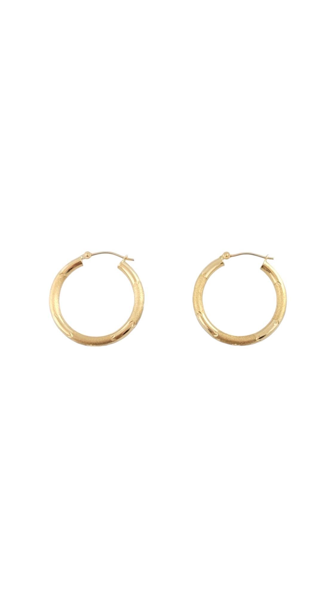 Vintage 14K Yellow Gold Hoop Earrings 

Hoop earrings in 14K yellow gold with designs.

Weight: 1.9 g/ 1.2 dwt

Hallmark: 14K ISRAEL

Size: 26.6 mm X 3 mm X 3 mm

Approximately 3 mm thick.

Very good condition, professionally polished.

Will come
