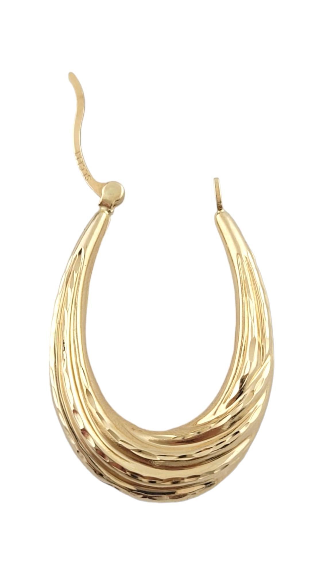 Women's 14K Yellow Gold Textured Oval Hoop Earrings #16188 For Sale