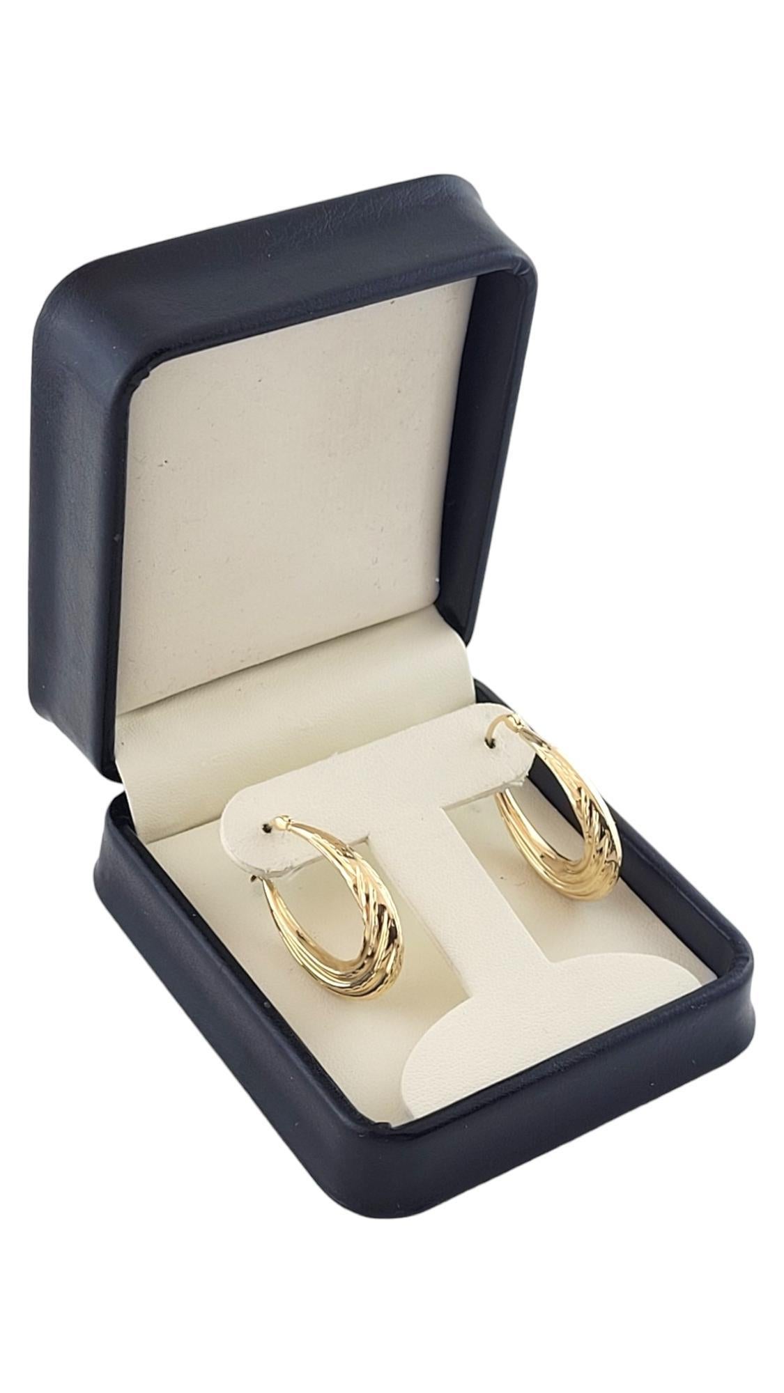 14K Yellow Gold Textured Oval Hoop Earrings #16188 For Sale 3
