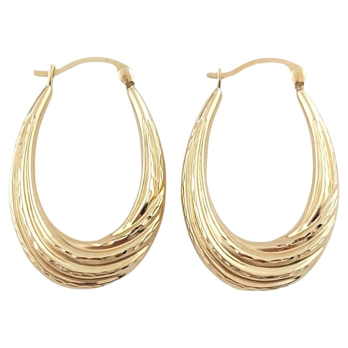 14K Yellow Gold Textured Oval Hoop Earrings #16188