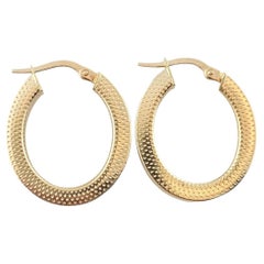 14K Yellow Gold Textured Oval Hoop Earrings #16189