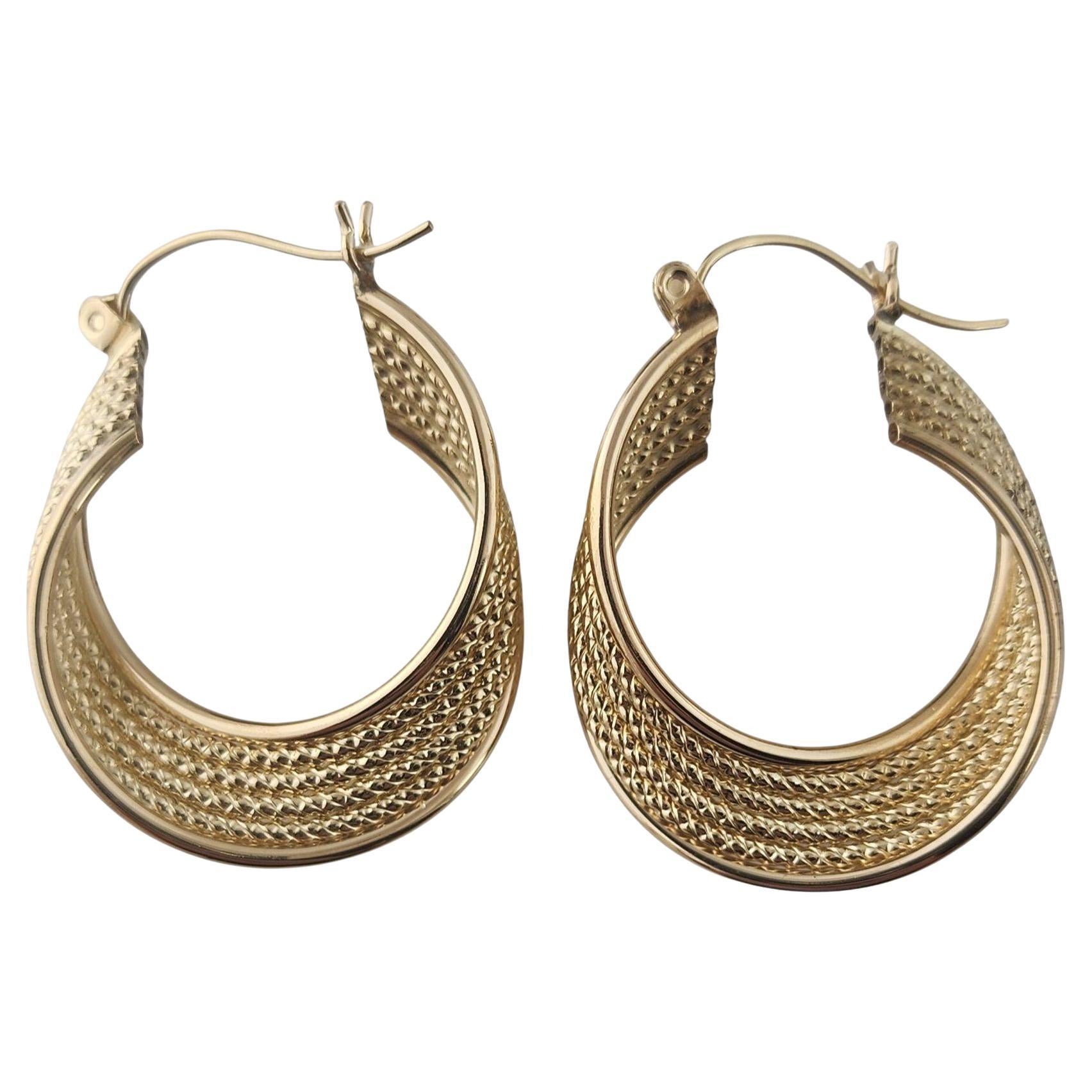 Orecchini a cerchio intrecciati in oro giallo 14k #23063