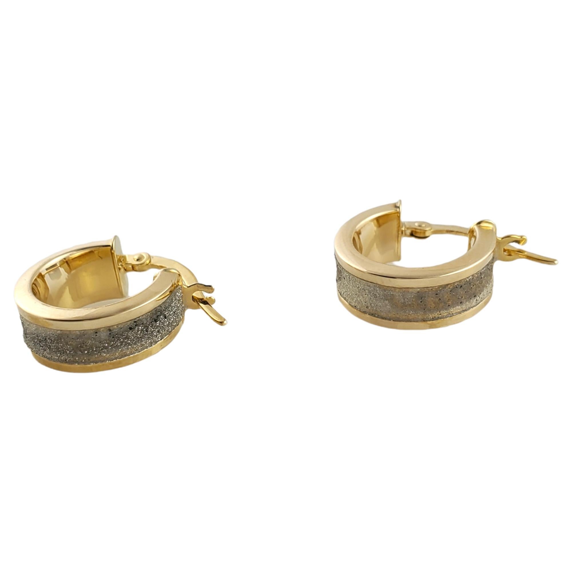 Vintage 14K Yellow Gold Sparkly Hoops

Breathtaking pair of 14K yellow gold hoops with beautiful sparkling detail.

Center is a 14K yellow gold textured area with sparkle.

Size: 16 mm X 18 mm

Weight: 2.0 g/ 1.2 dwt

Hallmark: 14KT Italy

Very good
