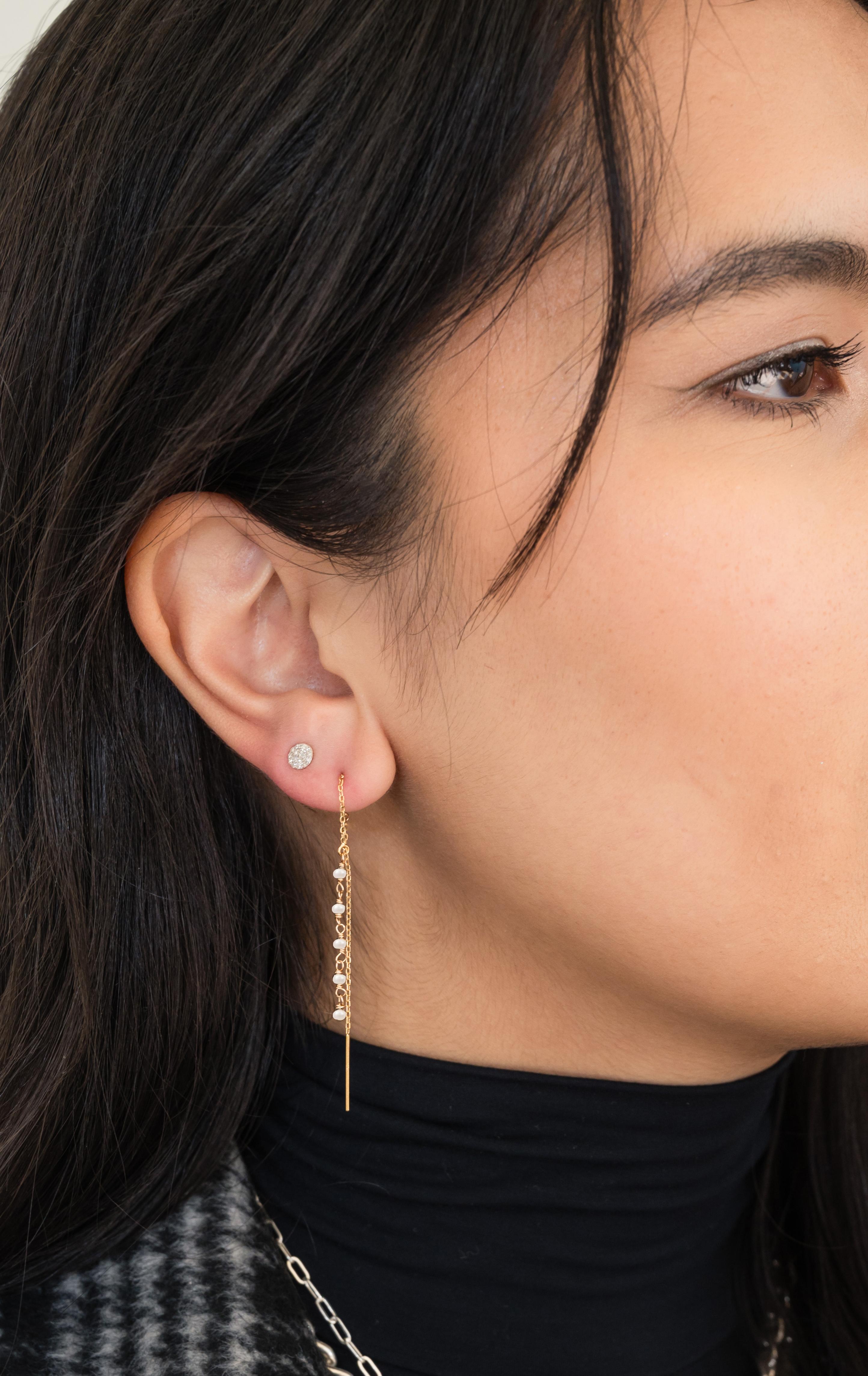 We took our 14K Gold Threader earrings and added some WOW! These earrings are airy, weightless, and sparkly-and now with a POP of color. You can wear them with everything so effortlessly! Wear dangling free, or pull through the loop for a different
