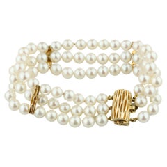 Bracelet en or jaune 14 carats à trois brins de perles avec accents en or de 17,78 cm de long