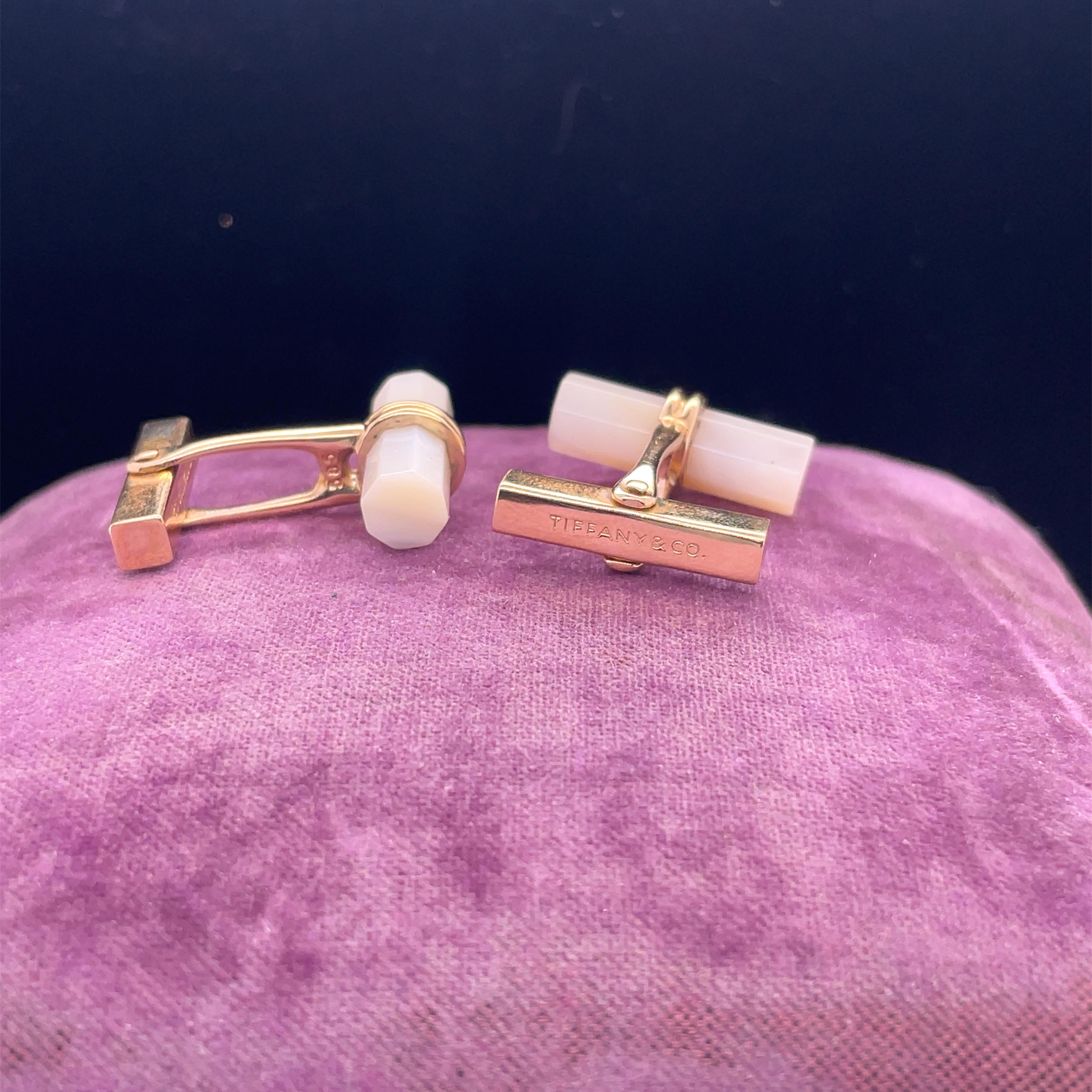 Year: 1960s
Hallmarks: Tiffany & Co

Item Details: 
Metal Type: 14K Yellow Gold [Hallmarked, and Tested]
Weight:  10.6 grams

Mother of Pearl Details:
Weight: 3.00ct, total weight approximately
Cut: Cylinder Shape
Color: White/Pink opaque

Cufflinks