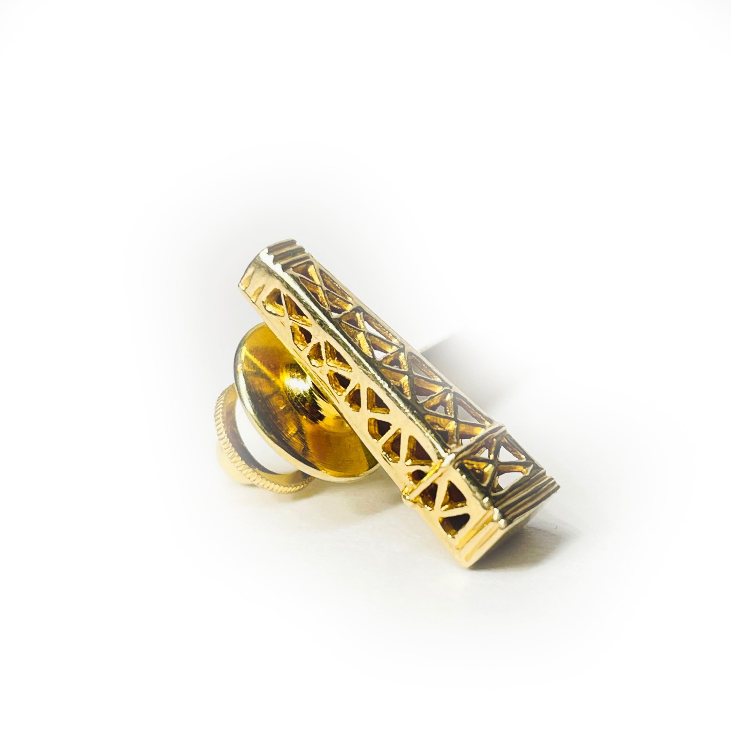 Make a bold statement with this exquisite 14k yellow gold tower pin, Weighing 3.9 grams expertly crafted to capture the timeless allure of the Art Deco era.  

Well Made & Design

