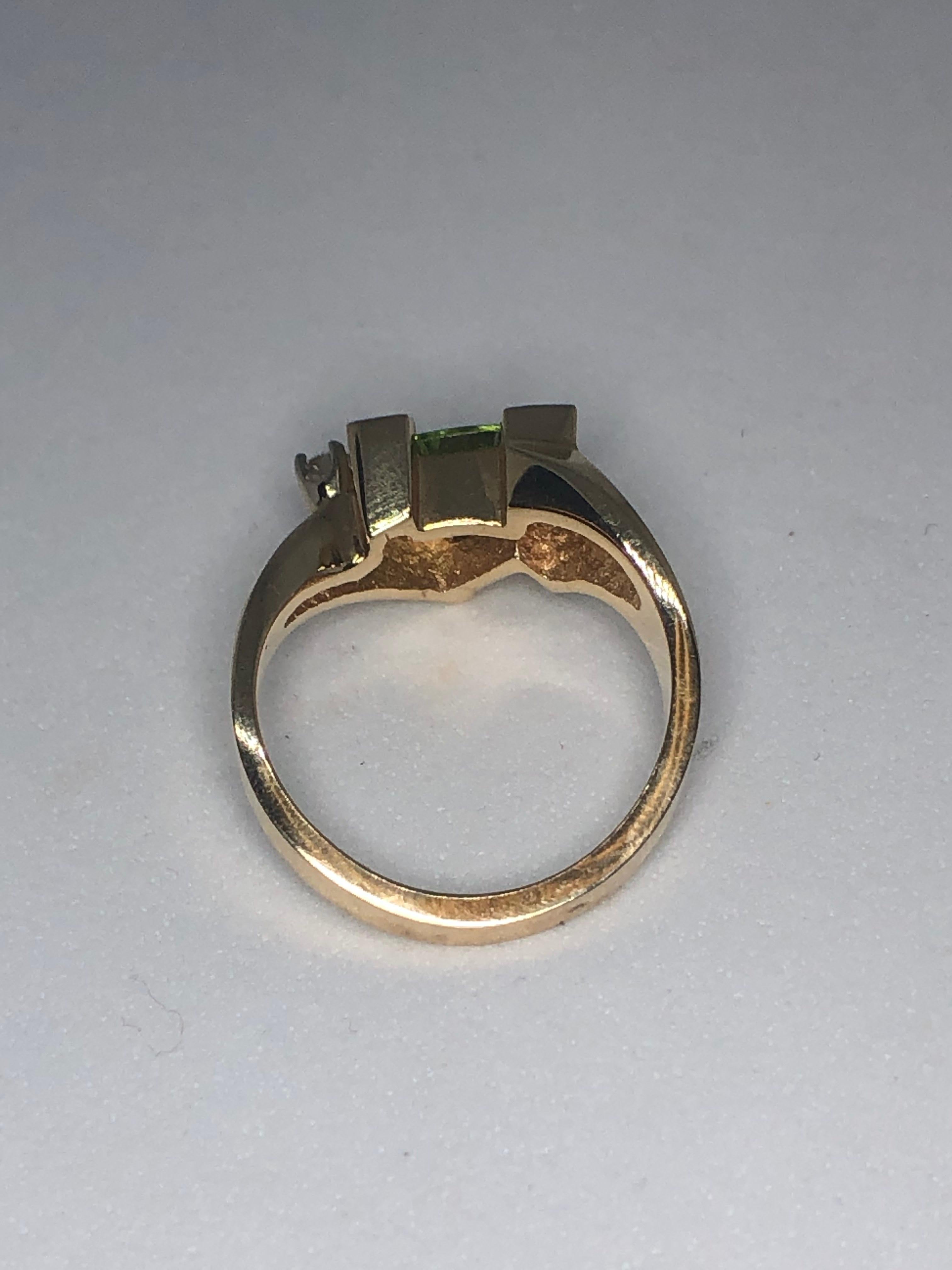 Women's 14 Karat Yellow Gold Trillion Cut Peridot and Diamond Ring by Aurum For Sale