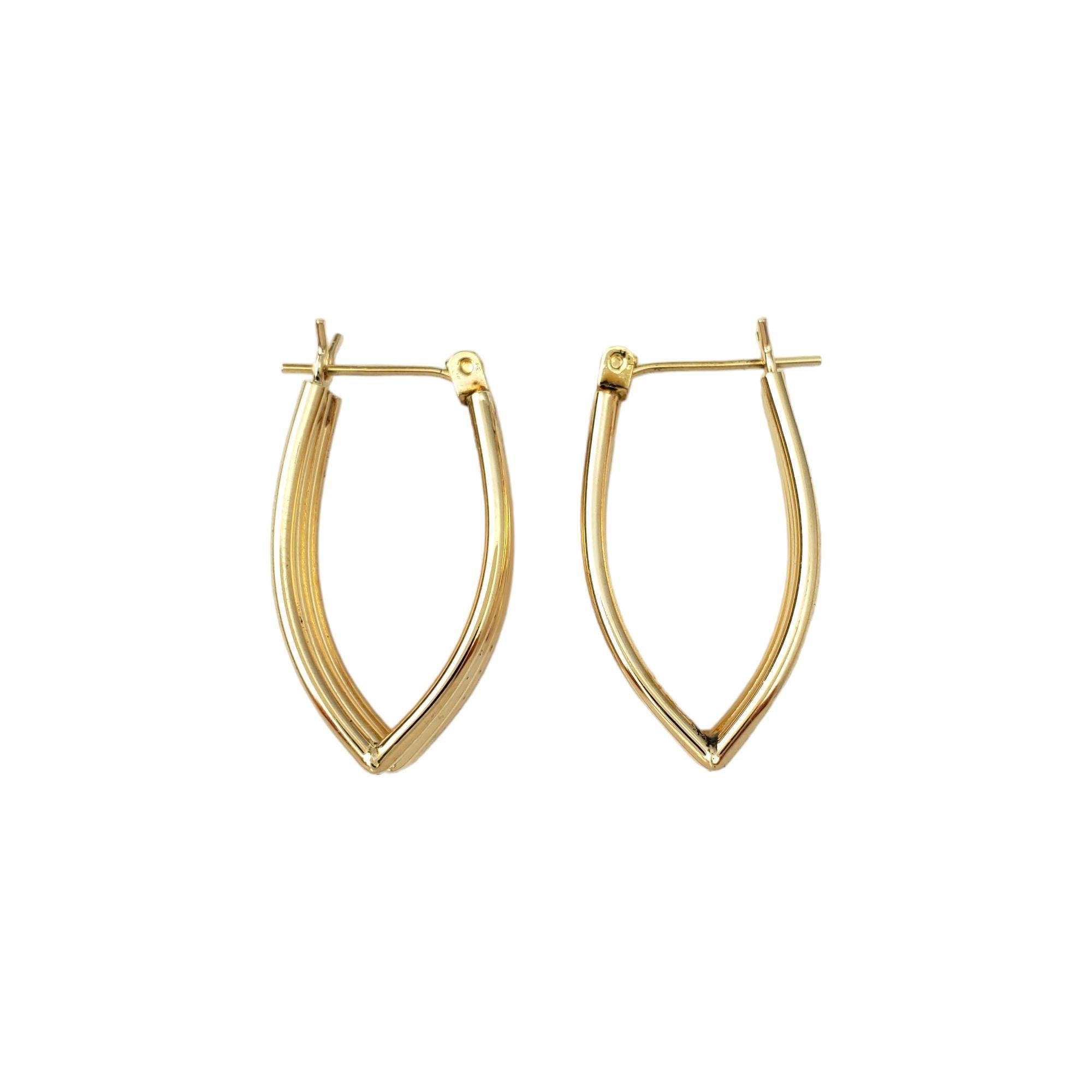 14K Yellow Gold Triple Hoop Earrings 

These gorgeous triple hoop earrings are a beautiful addition to your collection. 

Size:  27 mm X 14 mm X 2 mm

Weight:  1.9 dwt. /  2.9 gr.

Marked: 14K 

Very good condition, professionally polished.

Will
