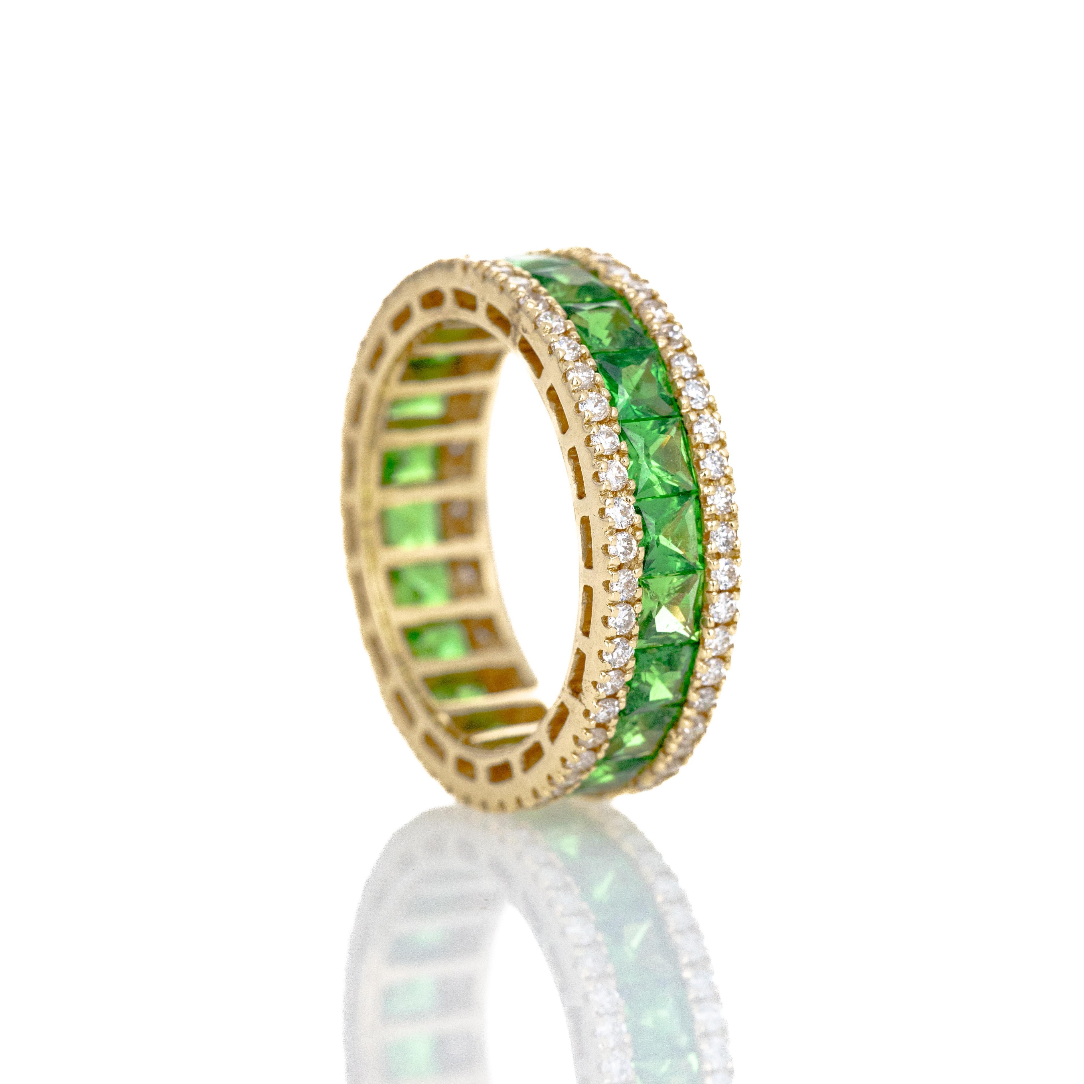 Era: New
Composition: 14K Yellow Gold
Primary Stone: Twenty-Two Square Natural Tsavorite Garnets
Carat Weight: 2.71 Carats in Total
Accent Stone: Round Brilliant Diamonds
Carat Weight: 0.76 Carats in Total
Color/Clarity: H-I / SI2
Ring Size: