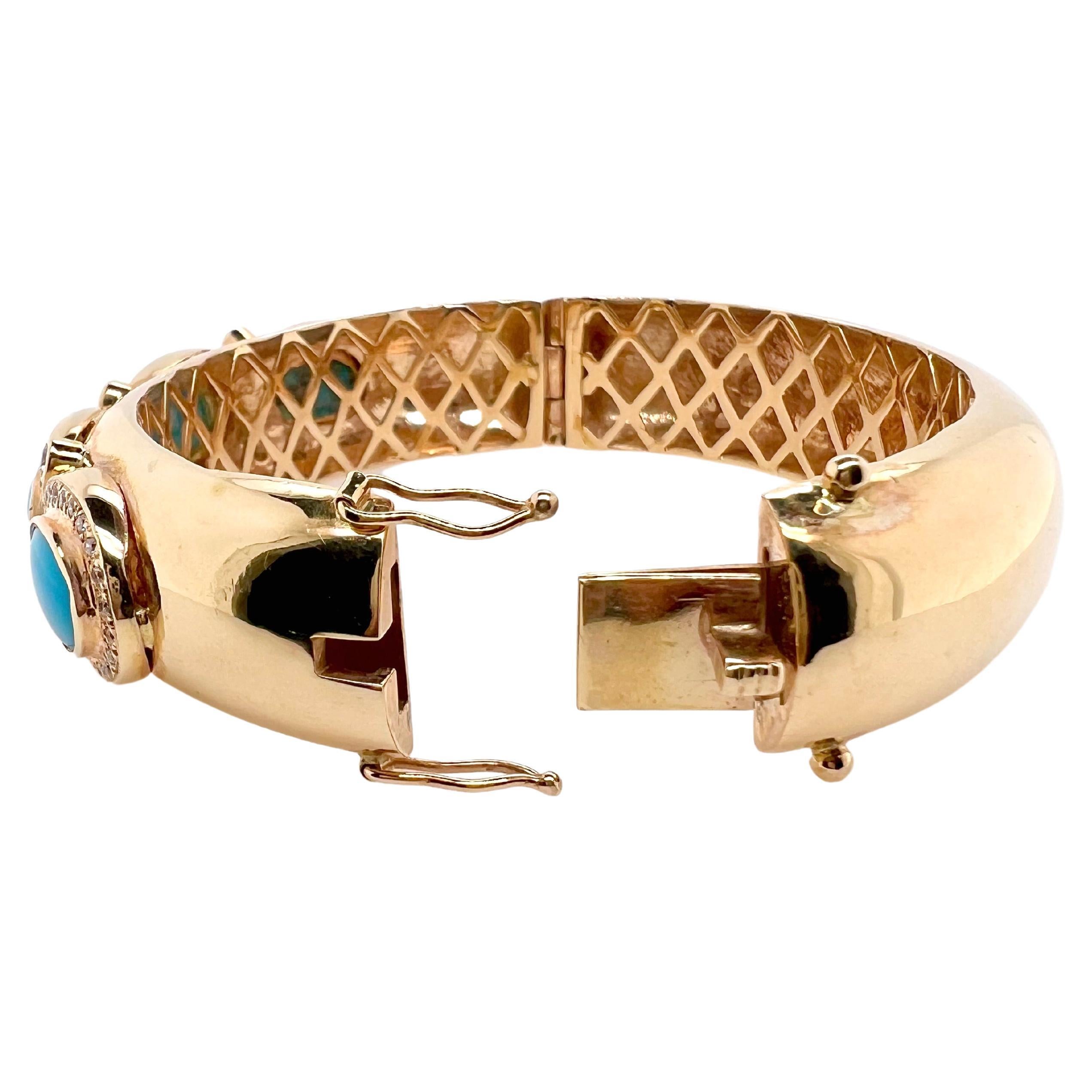 This stunning bangle is handmade with meticulous details.  The sleeping beauty turquoise are bezel set with round brilliant diamonds surrounding it.  The vibrant turquoise stands out agains the yellow gold and the bangle has an underneath gallery to