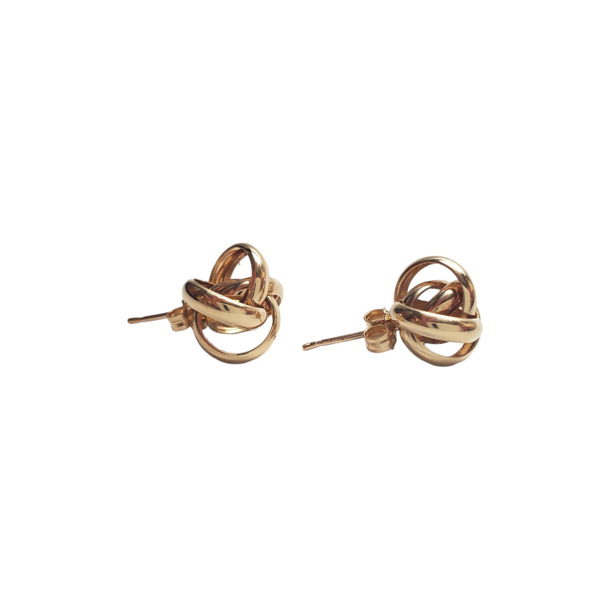 14K Yellow Gold Twist Ball Stud Earrings - 

These open ball studs are an eye catching addition to your jewelry collection. 

Size: 11.58 mm X 10.55 mm X 9.15 mm 

Weight: 1.25 dwt/ 1.96 g

Hallmark: 14K UL 

Very good condition, professionally