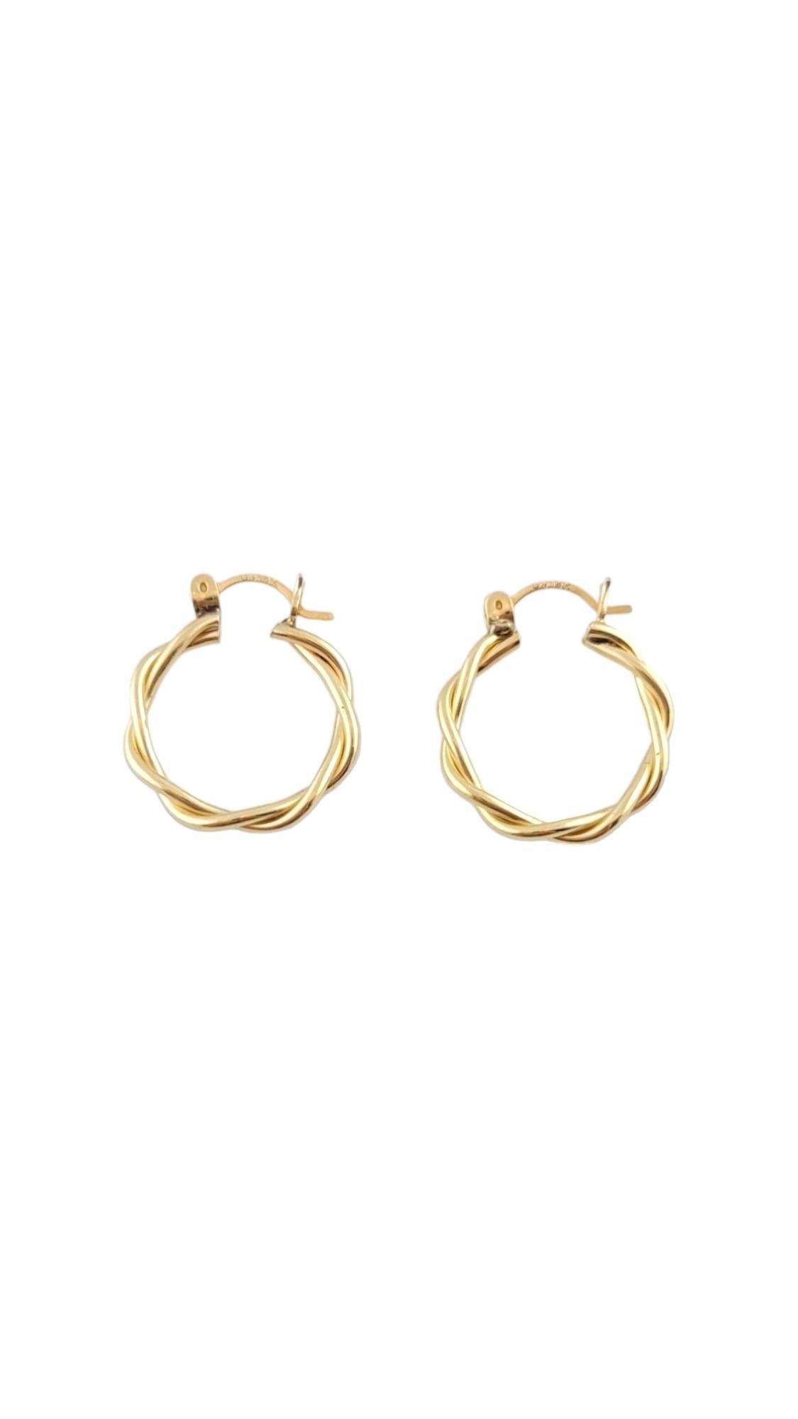 Vintage 14K Yellow Gold Twist Hoops

14 Karat yellow gold hoops with a twist design.

Size: 18.7 mm 

Approximately 2.4 mm thick.

Weight: 1.4 dwt/2.2 gr

Hallmark: UN 14K

Very good condition, professionally polished.

Will come packaged in a gift