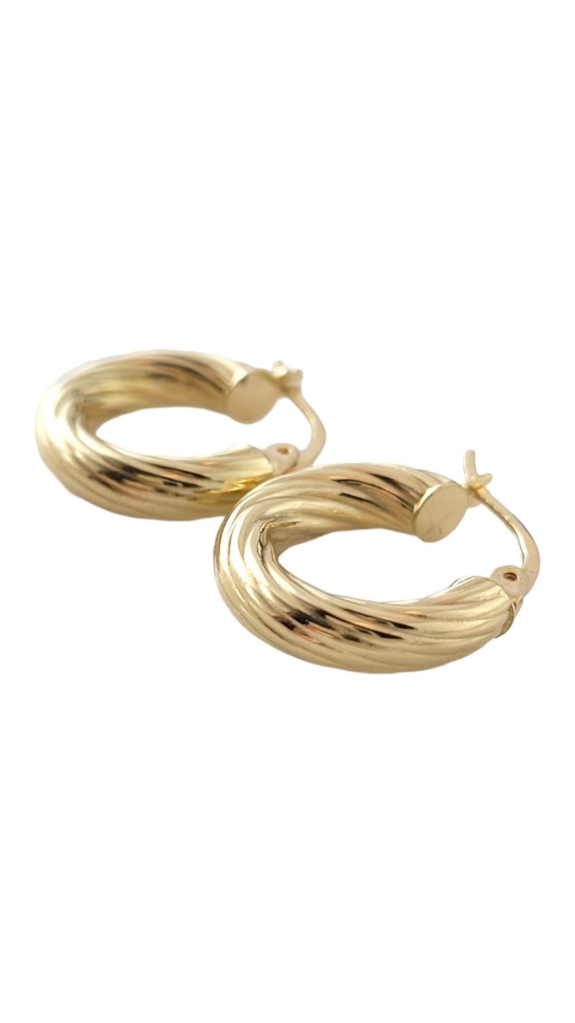 14K Yellow Gold Twisted Hoop Earrings

This gorgeous set of 14K gold hoops are in a beautiful, twisted pattern!

Size: 18.5mm X 4.2mm X 37mm

Weight: 1.1 dwt/ 1.7 g

Hallmark: ITALY ANO 14

Very good condition, professionally polished.

Will come