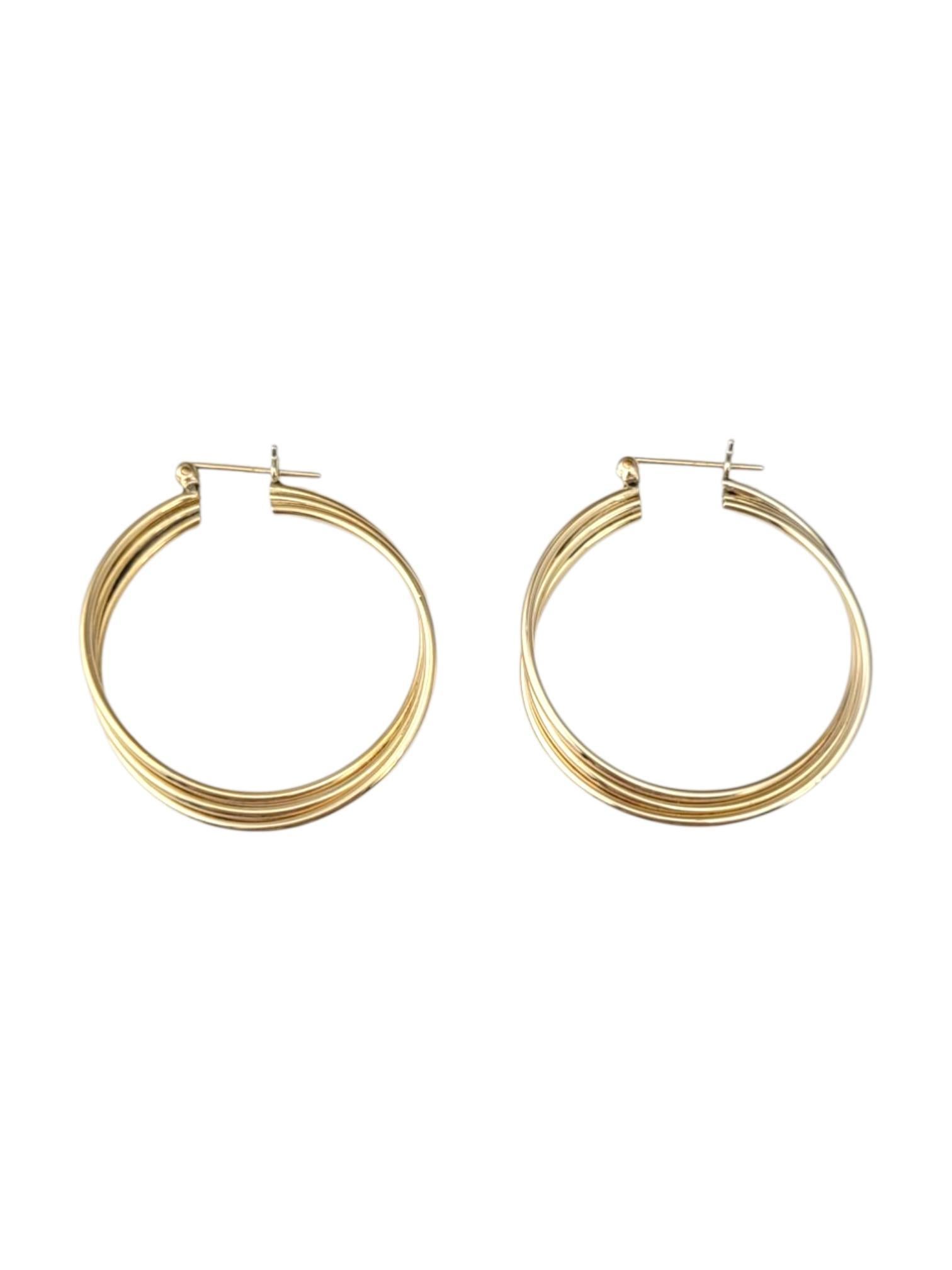 14K Yellow Gold Twisted Hoop Earrings -

These twisted hoop earrings feature an intricate spiral design that adds texture and dimension to a classic hoop shape. The unique twist catches the light beautifully, creating an elegant and dynamic