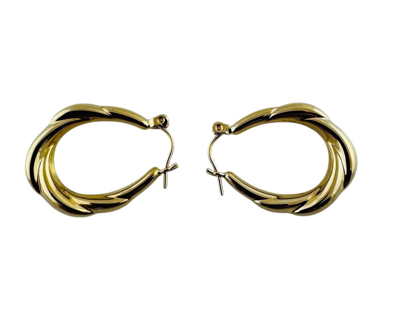 14K Yellow Gold Twisted Oval Hoop Earrings #20687 For Sale 1
