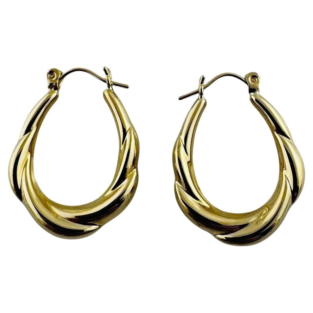 14K Yellow Gold Twisted Oval Hoop Earrings #20687