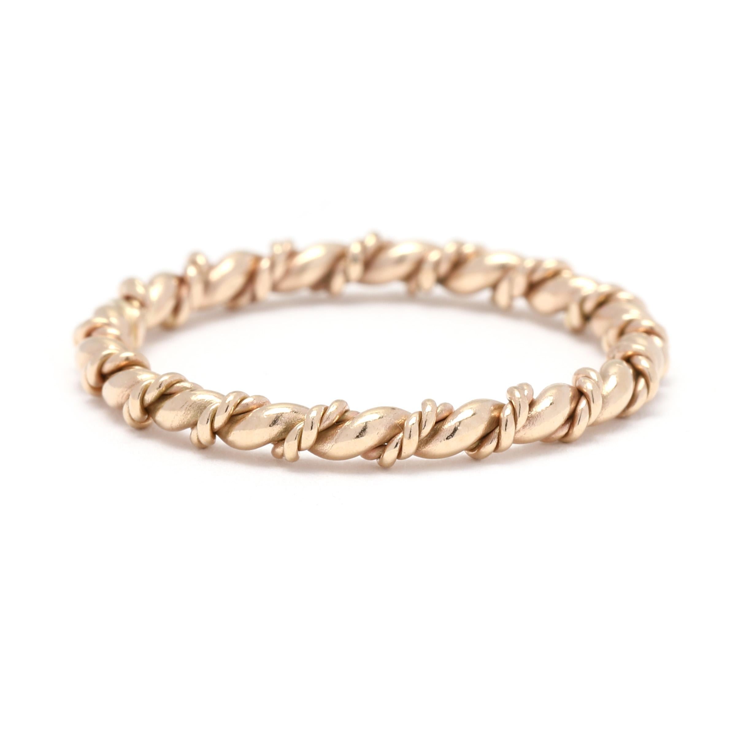 This dainty 14k yellow gold twisted rope eternity ring is the perfect addition to your ring stack. The twisted rope design adds a unique and eye-catching detail to the classic band ring. With a ring size of 5.25, this ring is perfect for stacking