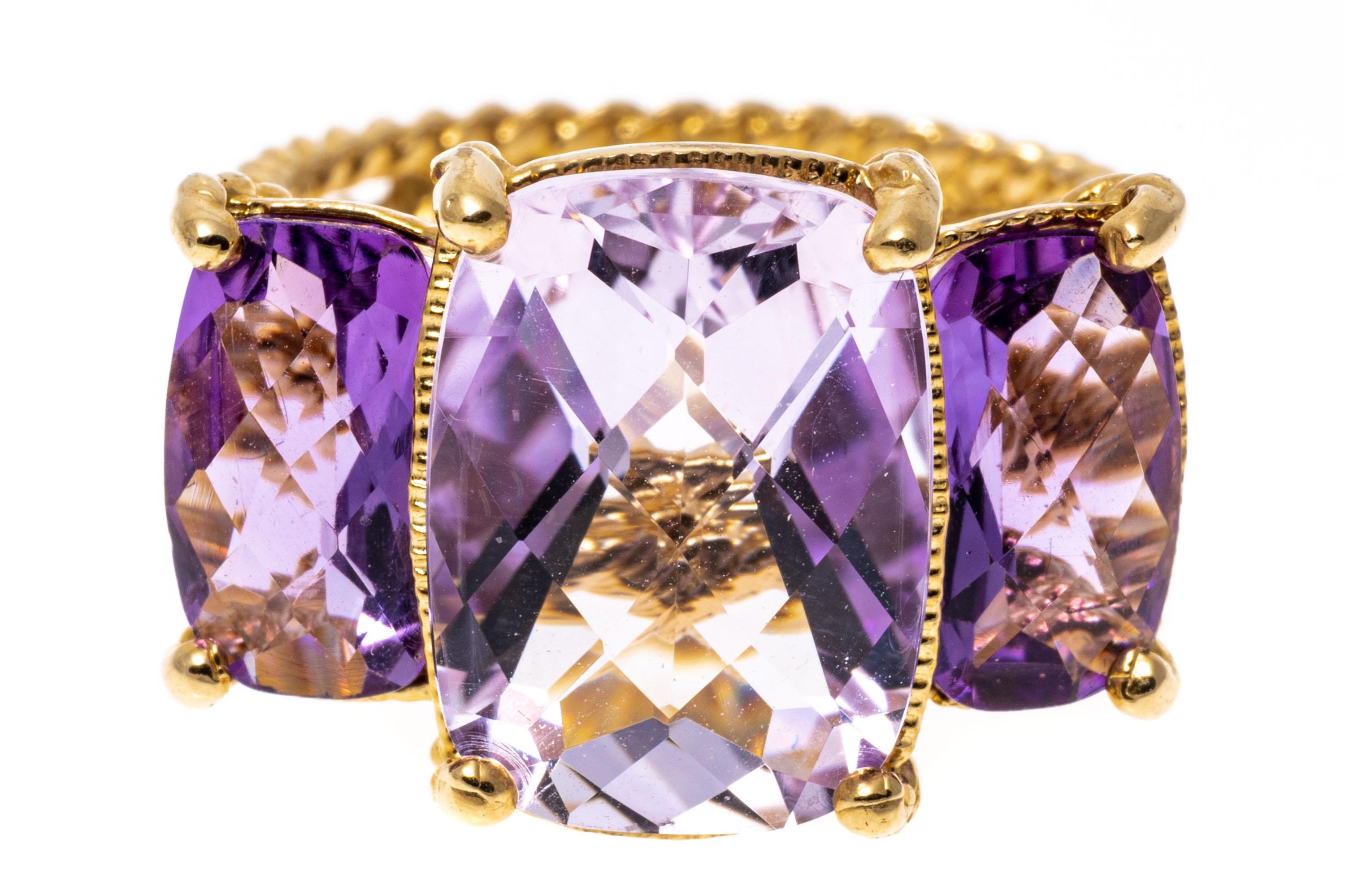 14k yellow gold ring. This pretty ring is a rectangular checkerboard cushion three stone style, with a center, pale purple color amethyst, flanked by two smaller light purple amethysts on the sides, prong set for a total weight of approximately 7.92