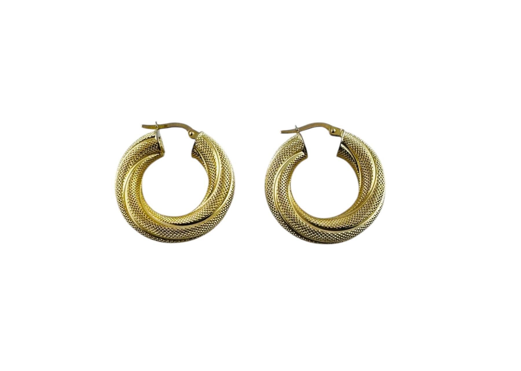 14K Yellow Gold Twisted Textured Hoop Earrings

These beautiful circular hoop earrings have a textured twisted design that adds sparkle to the ears!

Stamped: 14K Italy

5.98 g / 3.84 dwt

Measurements: 27.9 mm in length, 25.2 mm wide and 6 mm