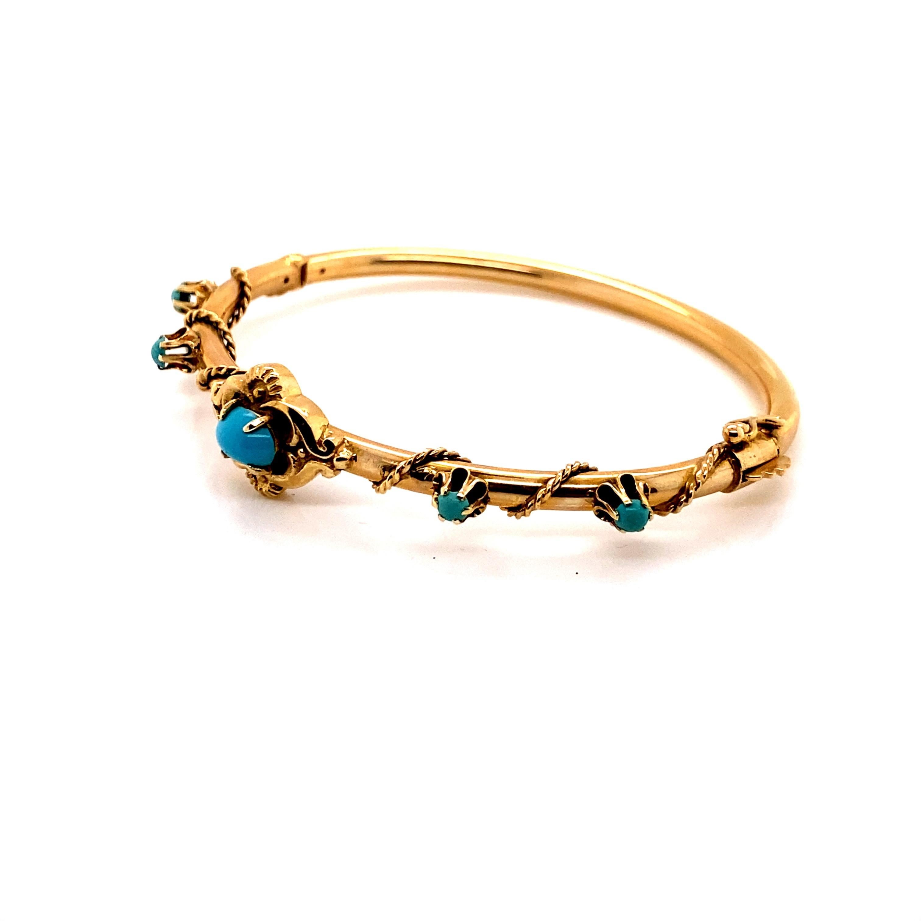 14K Yellow Gold Victorian Reproduction Bangle Bracelet with Turquoise - The oval turquoise measures 7x5mm and the 4 round turquoise measures 3mm. The width of the bangle measures 3.3mm. The inside diameter is 1.85 inches high and 2.25 inches wide.