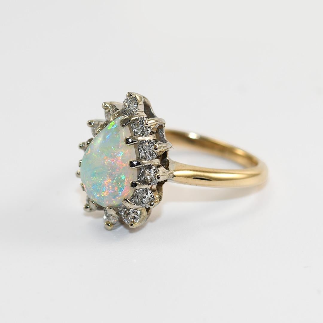 14K Yellow Gold Vintage Australian Opal & Diamond Ring
Ladies Austrialian opal and diamond ring.

The yellow gold setting tests 57% gold using a XRF metals analyzer. Gross ring weight is 3.6 gram.

The pearl shape opal measures 9.8mm by 7mm by