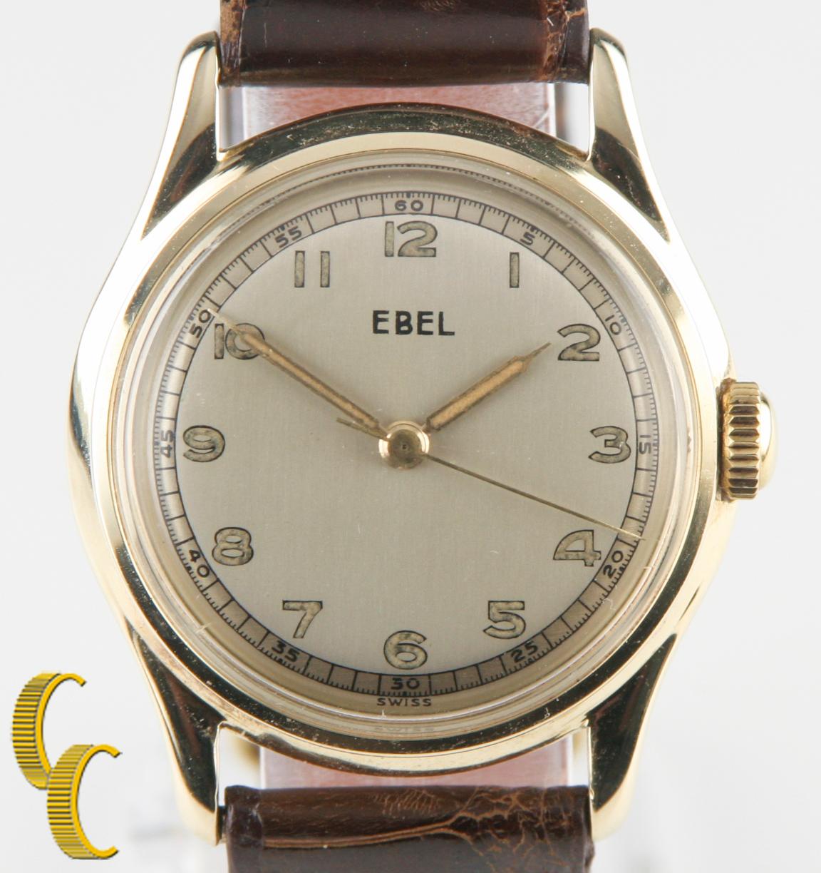 14k Gelbgold Vtg Ebel Hand-Winding Uhr w / braun Lederband

14k Gelbgold Gehäuse
31 mm im Durchmesser (33 mm mit Krone)
Abstand Lug-to-Lug = 39 mm
Dicke = 9 mm

Champagnerfarbenes Zifferblatt mit goldenen arabischen Ziffern und Zeigern (S, M, H)
27