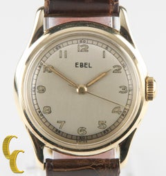Montre Ebel vintage en or jaune 14 carats à remontage manuel avec cadran rond en cuir marron