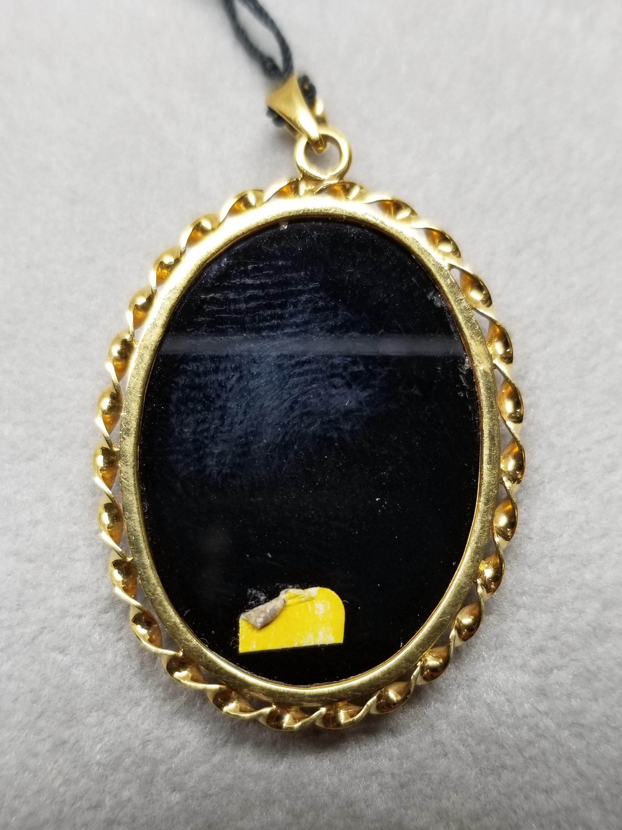 carved opal pendant