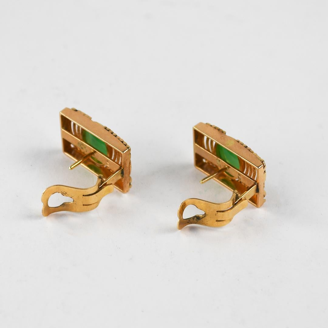 Ladies' vintage 14k yellow gold and jade earrings.
Stamped 14k and weighs 7.8 grams gross weight.
The natural jade is a light green color, measuring 10 x 7mm.
The earrings measure 20mm long and 12.5mm wide.
There are posts with clip backs for
