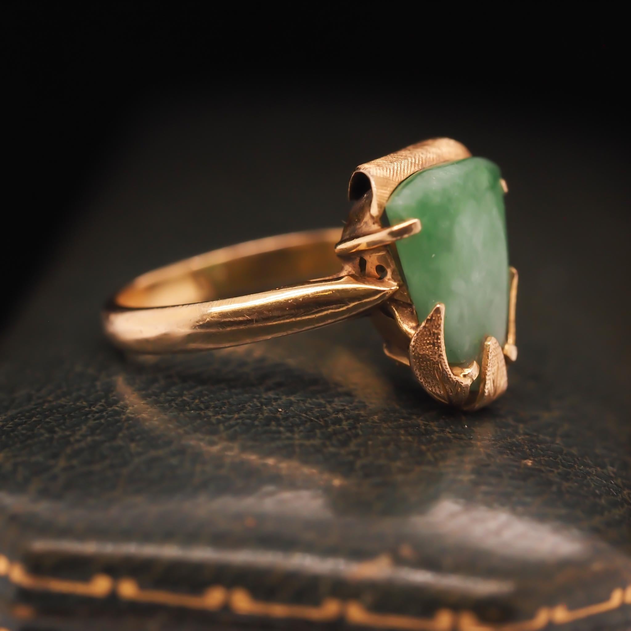 Year: 1960s
Item Details:
Ring Size: 7.25 (Sizable)
Metal Type: 14k yellow gold [Hallmarked, and Tested]
Weight: 4.2 grams
Jade Details: Green, 12x9mm approx.
Band Width: 2.7mm
Condition: Excellent
Era: Vintage