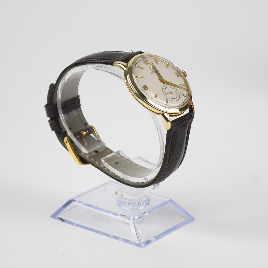 Men's Vintage Omega 14k yellow gold wristwatch.
Stamped 14k Omega inside the case.
Approximately, 11.5 grams of 14k gold without the movement.
The movement is the original Omega 17 jewel automatic mechanism.
Keeps time.
The case size is 32mm in