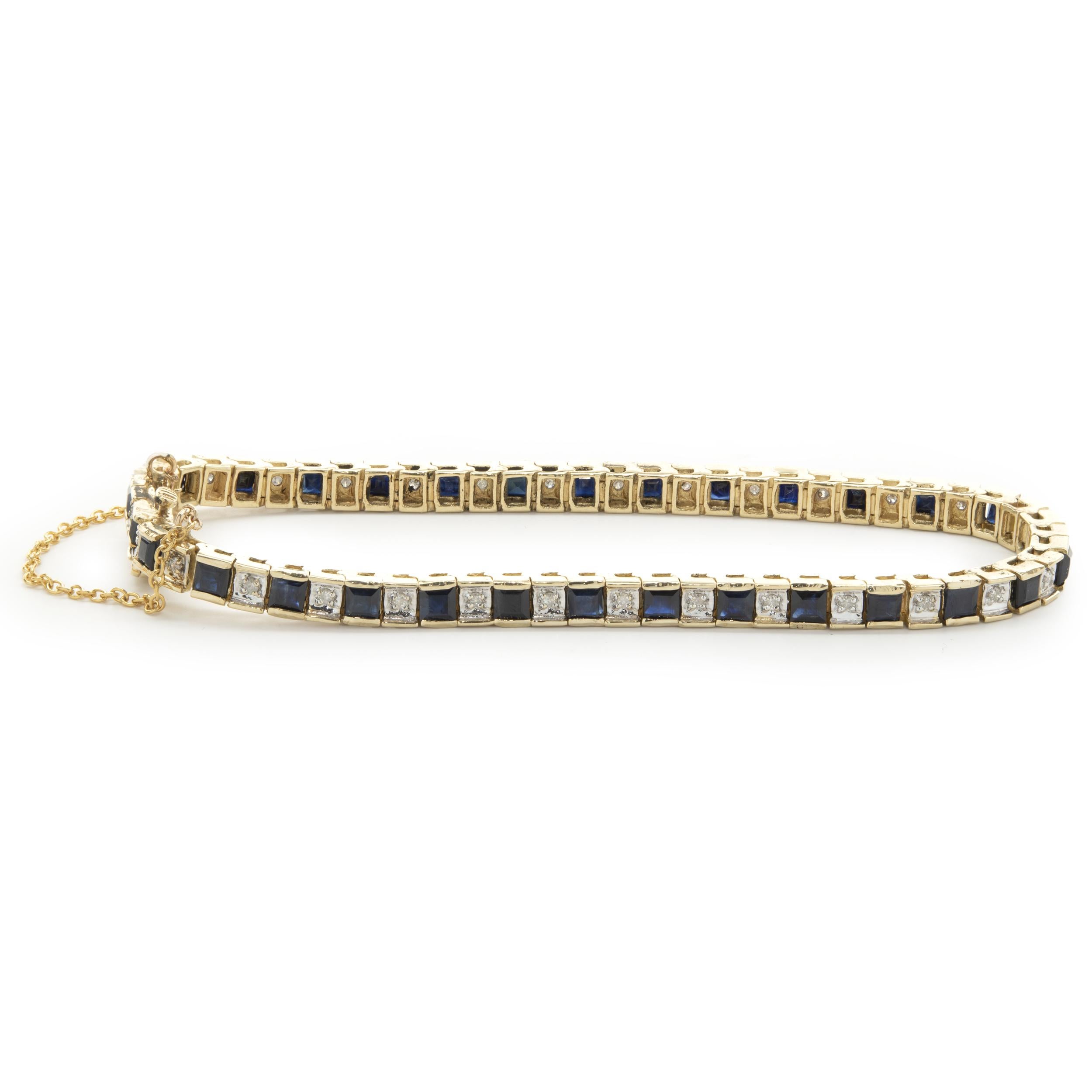 Designer: custom
Material: 14K yellow gold
Sapphire: 30 princess cut
Diamond: 30 round brilliant cut = 0.25cttw
Color: H
Clarity: SI2
Weight: 16.90 grams
Dimensions: bracelet measures 7.25-inches in length