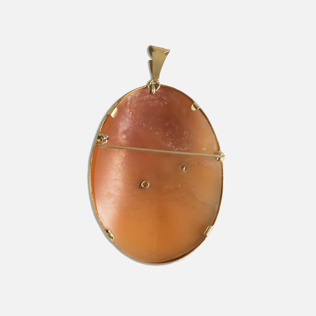 Vintage hand-carved shell cameo brooch/Pendant with thick 14k yellow gold bezel.
The bezel tests 56.7% gold with an XRF metals analyzer.
The gross weight of the cameo brooch is 20.2 grams.
There is a small old-Euro cut diamond on the necklace of the