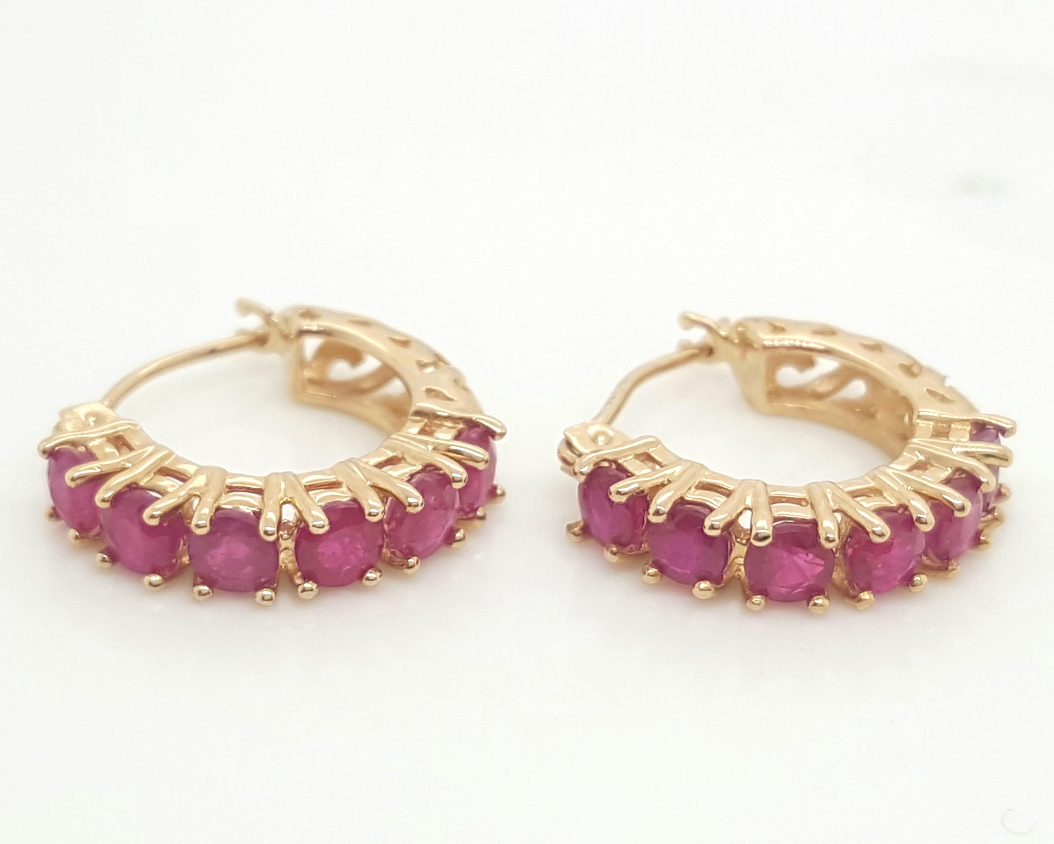 14K Yellow Gold Vintage Style Ruby Hoop Huggie Earrings. Theses vintage inspired earrings feature by 12 round rubies weighing a total of approximately 1.20 carats. They are adorable and classic and perfect for any occasion!
  
Earrings