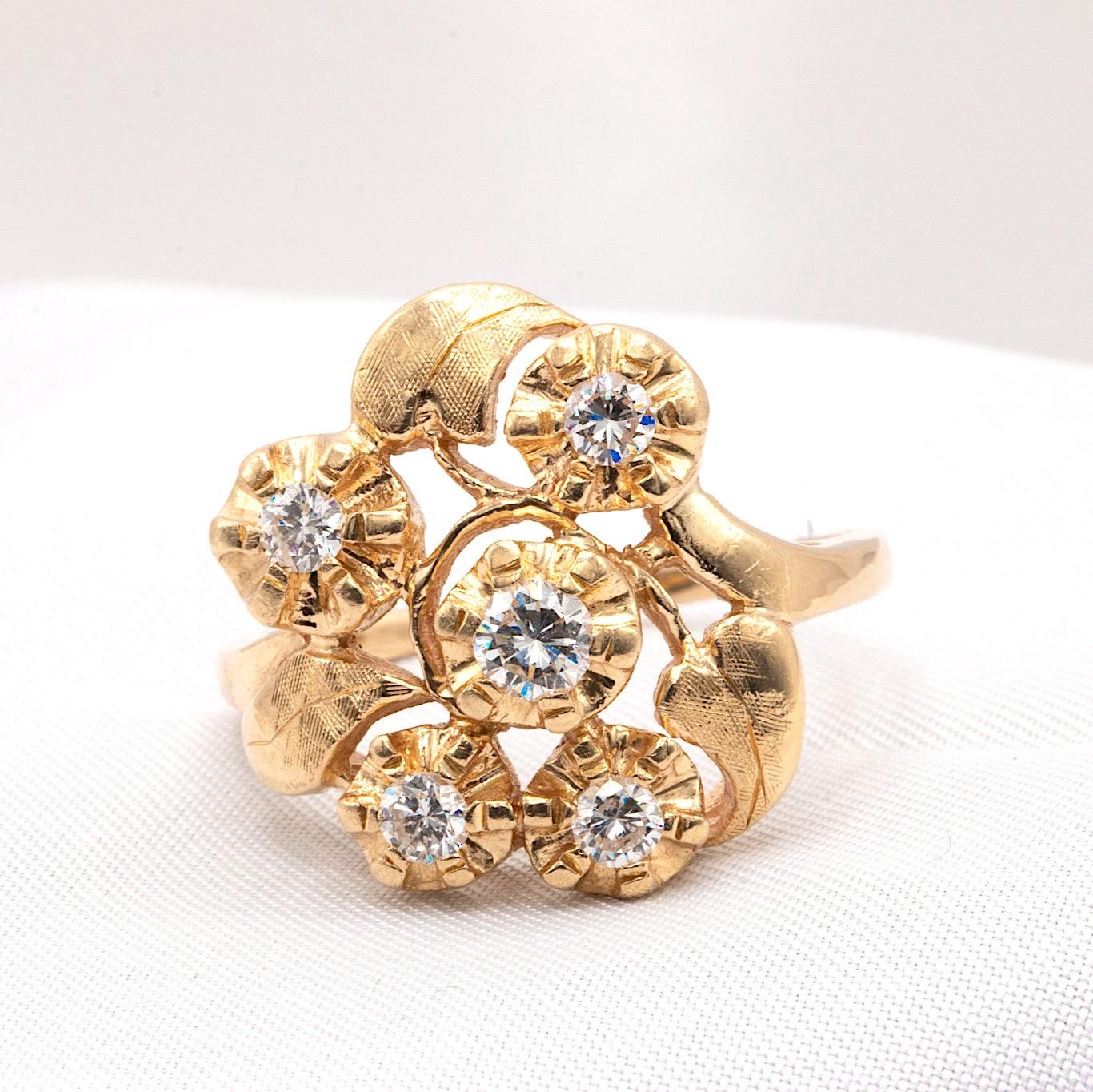 Beautiful pre-owned and renewed vintage flower-style diamond ring in 14K yellow gold, weighing 7 grams and currently sized at 9, with resizing available. This unique piece features an estimated 0.50 carat of diamonds with a G-H color grade and SI1