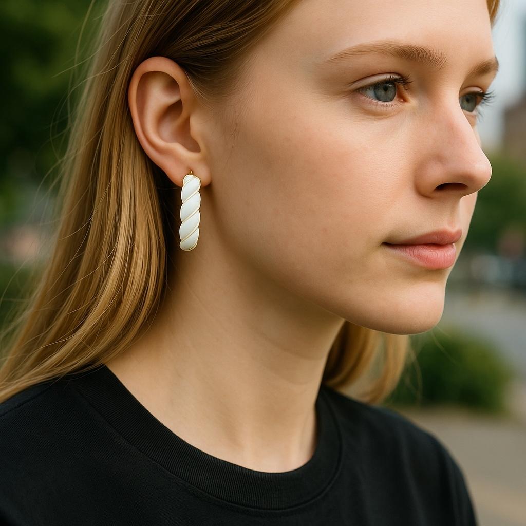 Embrace the timeless allure of vintage artistry with these exquisite 14K Yellow Gold Rope Twist Hoop Earrings, meticulously crafted to celebrate the nearly lost tradition of hand-applied enamel work. 

These statement pieces, adorned with a lustrous