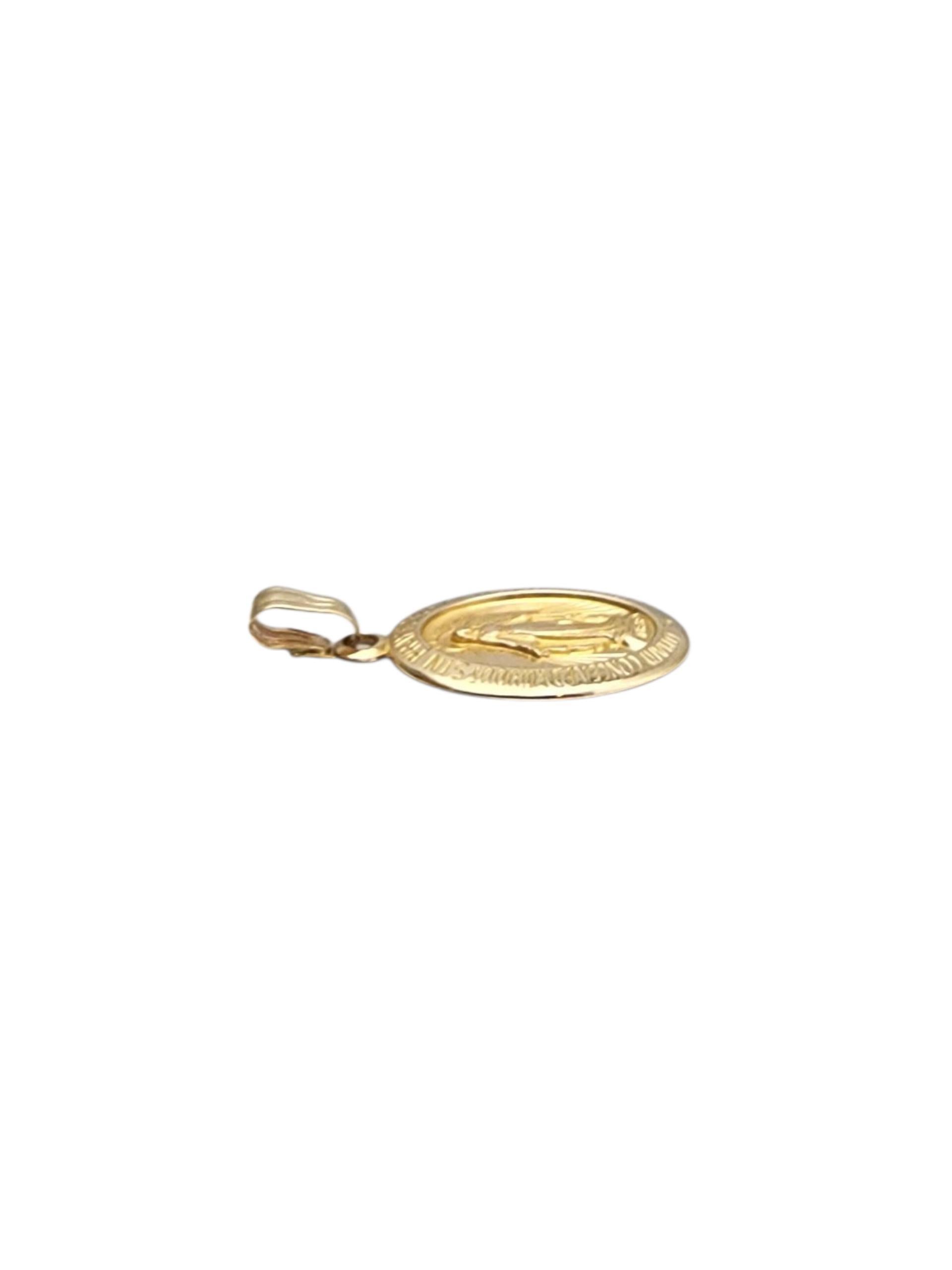 14K Yellow Gold Virgin Mary Miraculous Medal Pendant-

14K yellow gold Virgin Mary pendant with intricate detailing—classic, spiritual, and deeply meaningful.

Size with bail: 20 mm x 11.2 mm x 1.1 mm
Size without bail: 18 mm

Weight: 1 gr./ 0.6