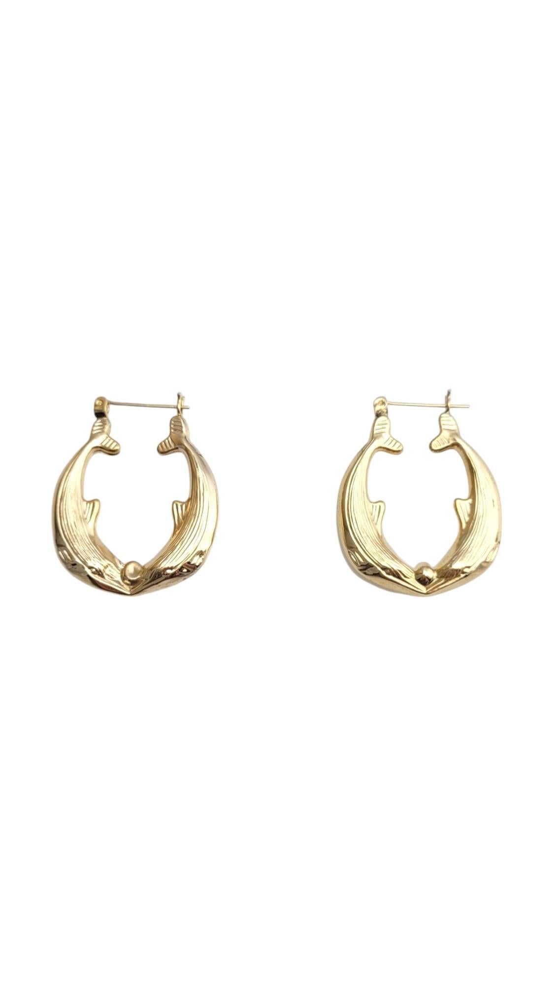 14K Yellow Gold Whale Hoop Earrings

These hoop earrings feature a meticulously detailed whales on each side of the hoops in 14K yellow gold.

Hallmark: 14Ko

Weight: 4.5 g / 2.9 dwt.

Size: 33.4 mm X 5.2 mm X 6.9 mm

Very good condition,