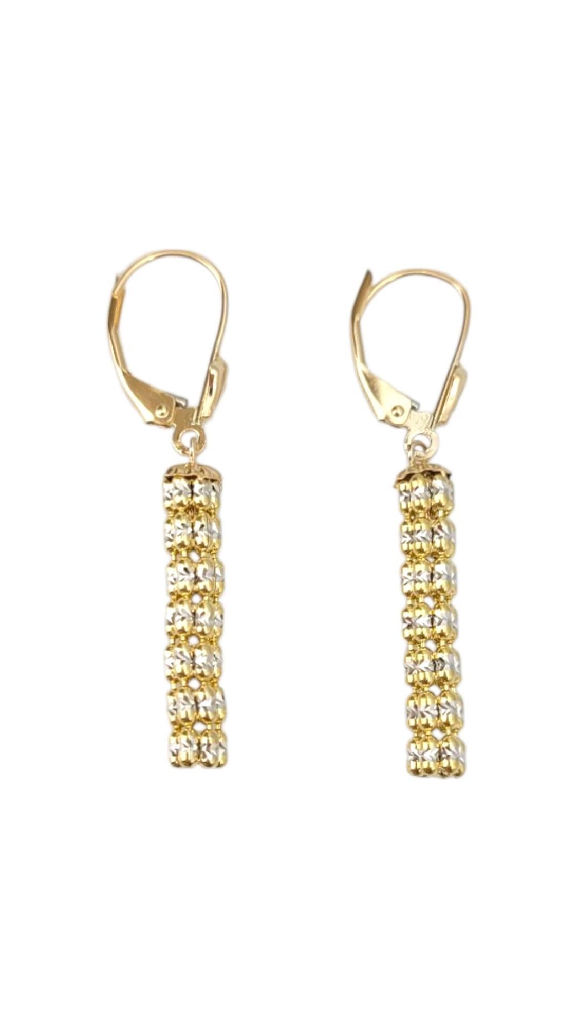 14K Yellow Gold & White Gold Two Tone Flexible Dangle Earrings -

These two-tone hoop earrings blend the elegance of yellow and white gold for a sophisticated, modern look. Their sleek design adds versatile style to any outfit, making them a perfect