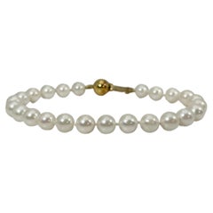Bracelet en or jaune 14 carats avec perles blanches