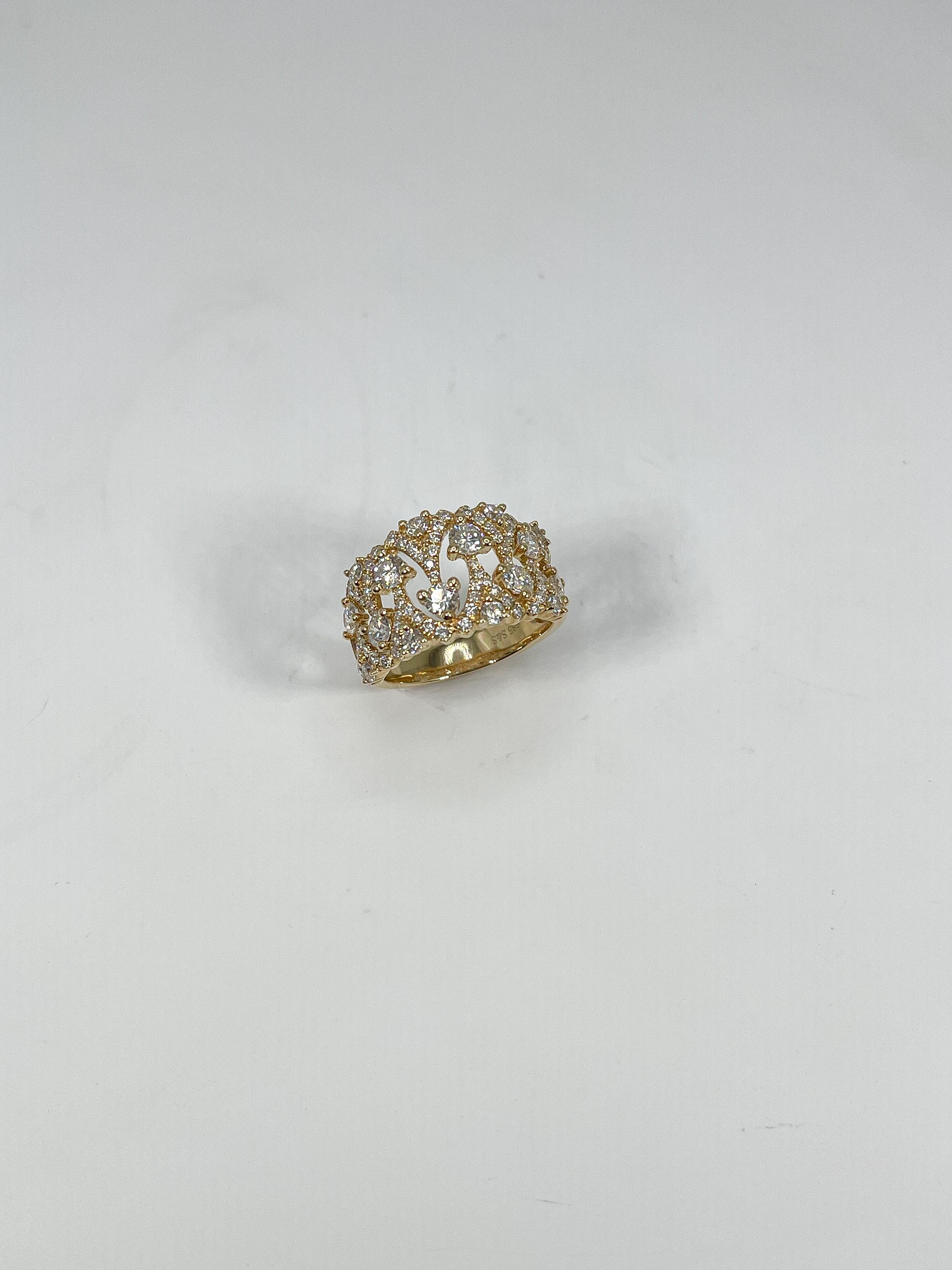 14k yellow gold wide 1.75 CTW contemporary diamond band. The diamonds in this band are all round, ring is a size 6 1/2, has a width of 12.7, and a total weight of 5.5 grams.