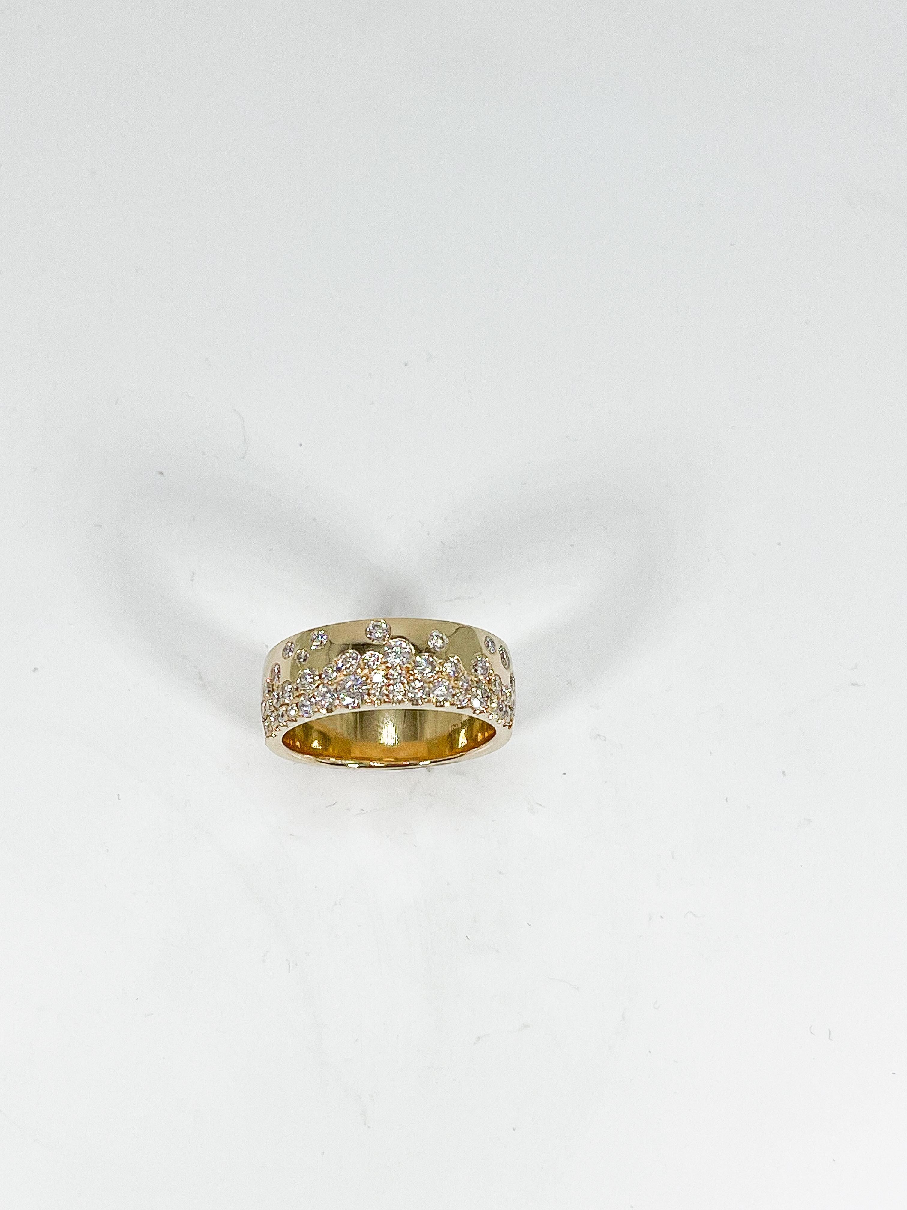 14k yellow gold wide .90 CTW diamond band. Ring has round diamonds varying is size, has a width of 6.9 mm, measures to be a size 7, and has a weight of 7.3 grams.