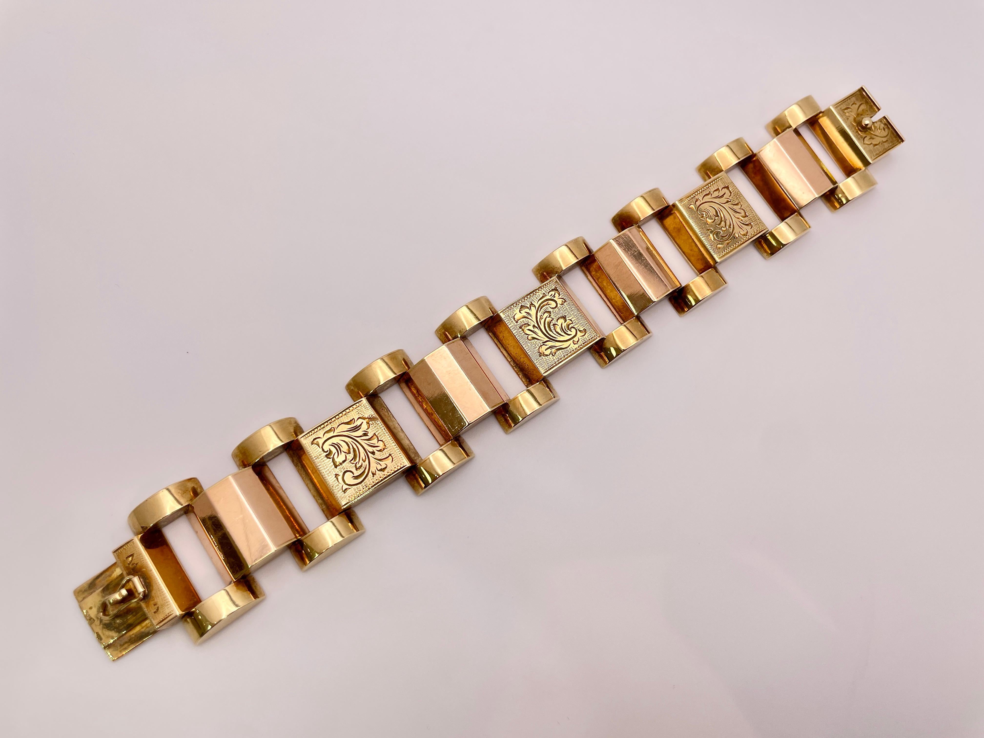 An original antique 14K yellow and rose gold wide link bracelet featuring a floral motif design, Circa 1930's.   This beautiful bracelet measures 7.50 inches length and 1.25 inches in width, with a gross weight of 91 grams. Embrace timeless elegance