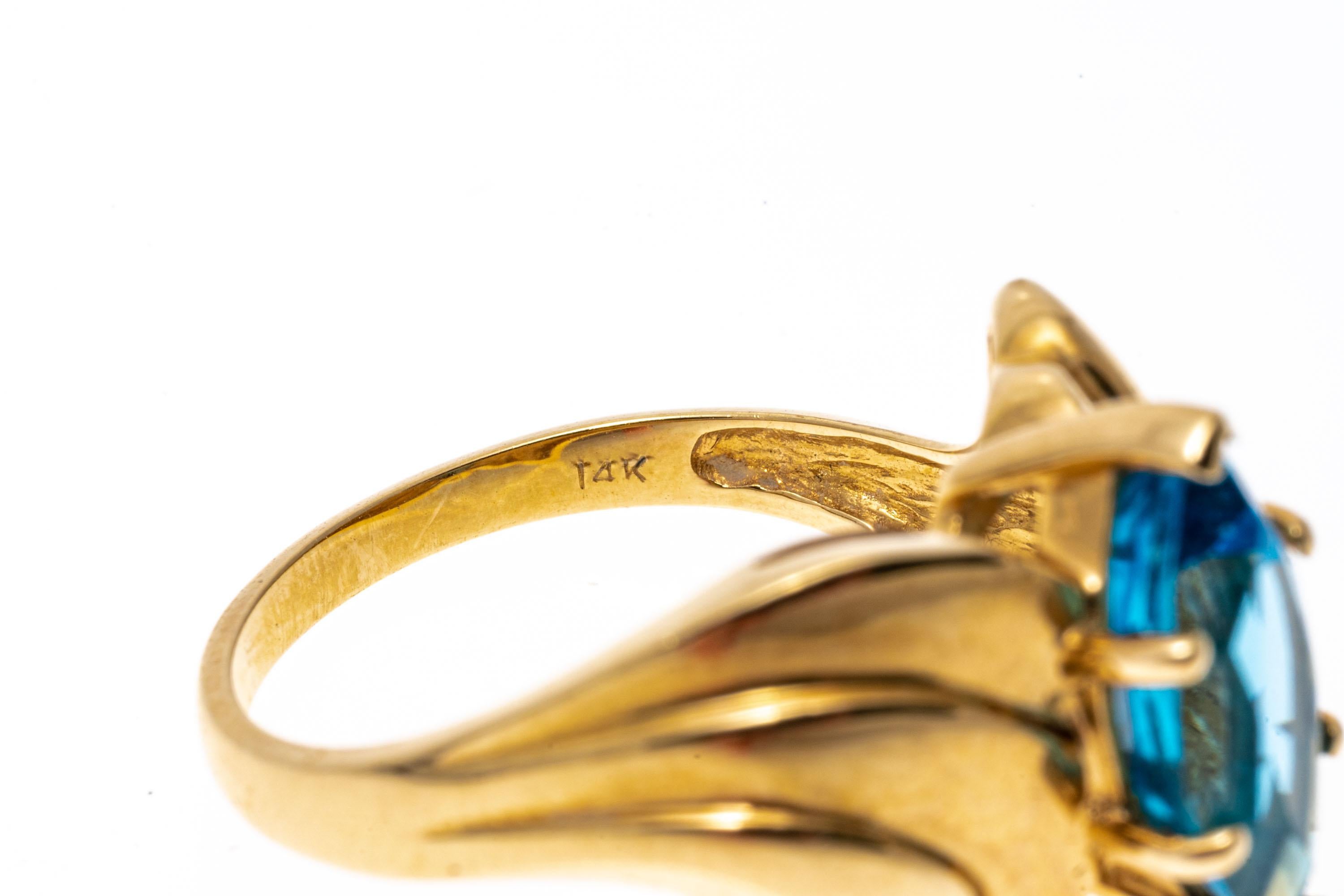 14k Yellow Gold Wide Ribbed Bypass Style Marquise Blue Topaz Ring In Good Condition For Sale In Southport, CT