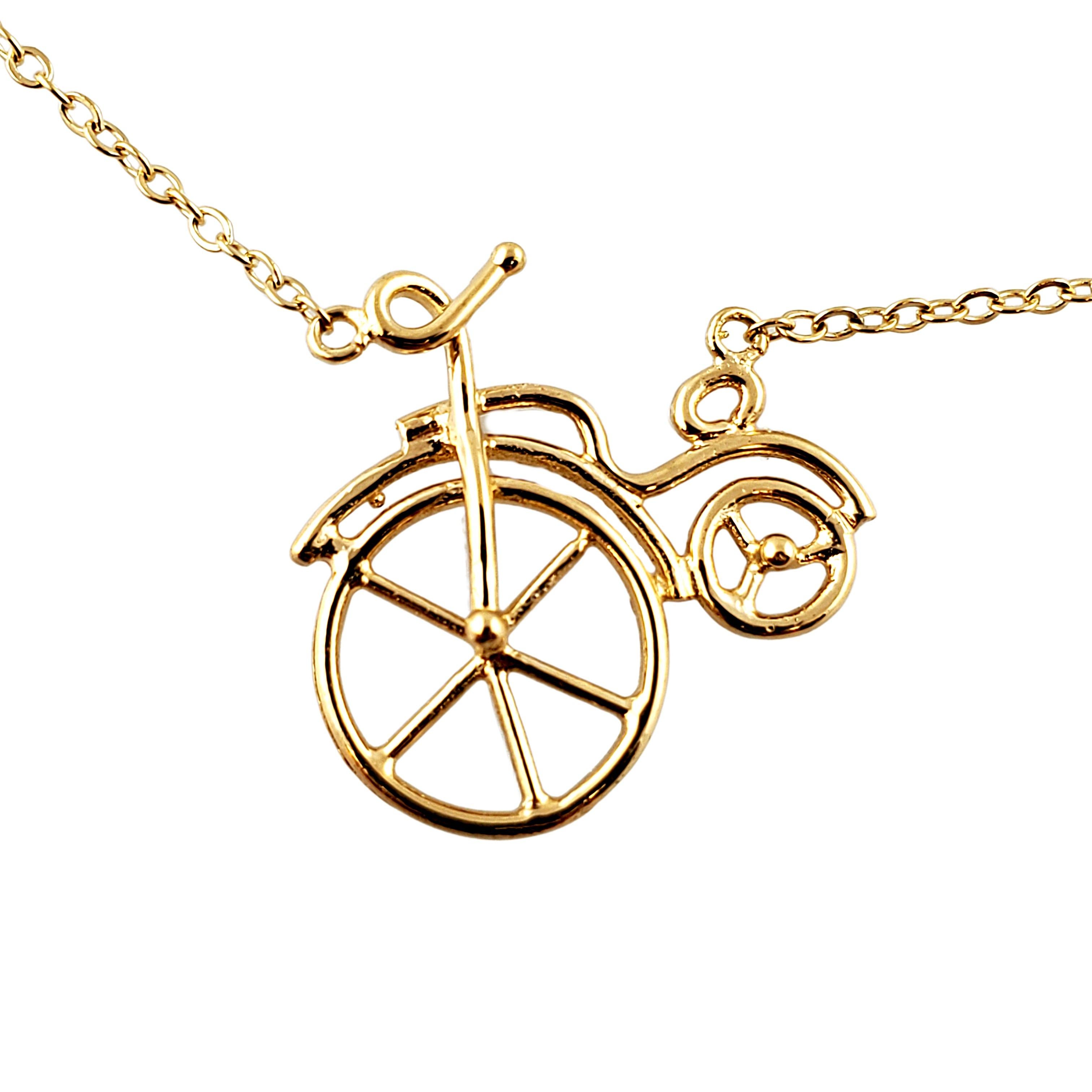 14K Yellow Gold Wire Bike Necklace

Beautiful 14K yellow gold Wire Bike Necklace features a bike called the Penny-Farthing which was very popular in the 1870s-1880s. It was the first machine called a bicycle and the large front wheel was designed
