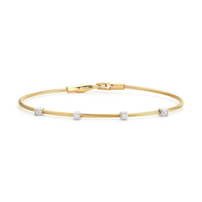 14 Karat Yellow Gold Hand-Crafted Wire Bracelet, Accented with 0.20 Carats of Prong Set Diamonds.
